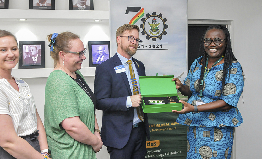 Professor (Mrs.) Rita Akosua Dickson, Vice-Chancellor (Right) Presenting a KNUST Souvenir to Dr. Greg Heigberger, Associate Dean, Academics and Student Success, SDSU